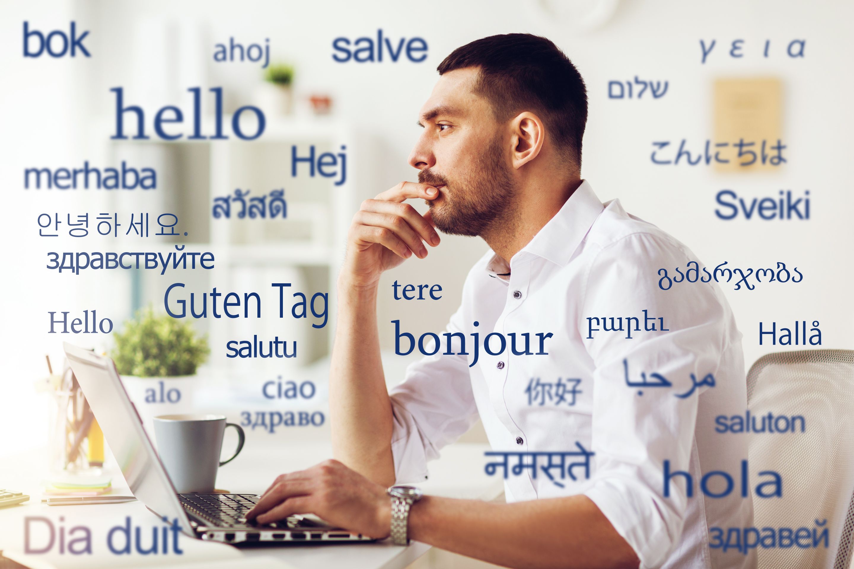 Photo of man with laptop and overlay of the word hello in different languages